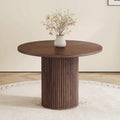 Table de salle à manger ronde de 107 cm dotée de rangement, table ronde moderne avec plateau en bois et piètement cylindrique, table de cuisine ronde peu encombrante pour salle à manger.